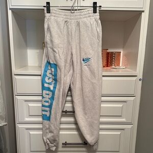 Nike Kids Light Gray Joggers with Blue Logo